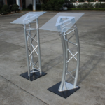 podium, lectern, podium stand, lectern stand, presentation podium, speaker podium, conference podium, church podium, school podium, office podium, public speaking podium, professional podium, modern podium, wooden podium, metal podium, acrylic podium, portable podium, adjustable podium, standing podium, floor podium, presentation stand, speaker stand, speech podium, lecture podium, teaching podium, classroom podium, training podium, seminar podium, meeting podium, conference lectern, presentation lectern, church lectern, pulpit podium, pulpit stand, church pulpit, school lectern, teacher podium, teacher lectern, lecturer podium, lecturer stand, university podium, college podium, institutional podium, corporate podium, business podium, executive podium, office lectern, meeting lectern, conference lectern stand, event podium, event lectern, ceremony podium, graduation podium, wedding podium, function podium, event presentation stand, public address podium, microphone podium, podium with microphone, microphone lectern, speech stand, speaker lectern, presenter podium, presenter stand, presentation furniture, conference furniture, office presentation furniture, classroom furniture, school furniture, university furniture, college furniture, training room furniture, seminar furniture, boardroom podium, boardroom lectern, meeting room podium, meeting room lectern, conference room podium, conference room lectern, auditorium podium